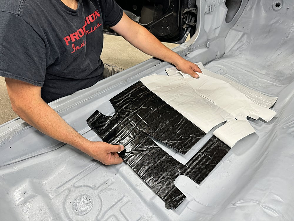 008 Preparing adhesive backing for sound-deadening insulation in the interior of a Camaro copy