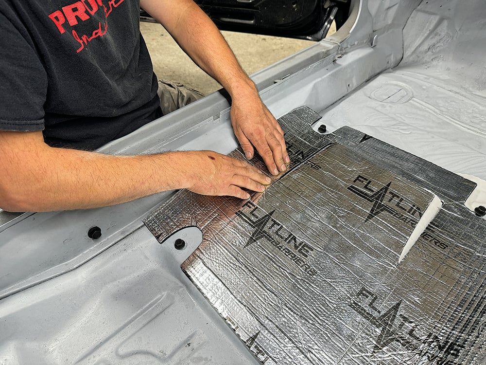 009 Final adjustments being made as the technician installs Flatline sound-deadening insulation on the Camaro’s floor copy