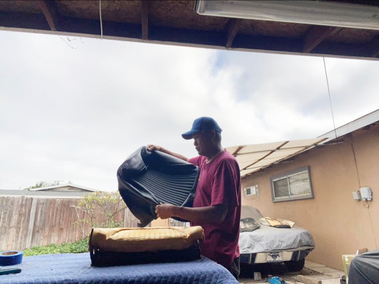 Rudy putting on front seat covers