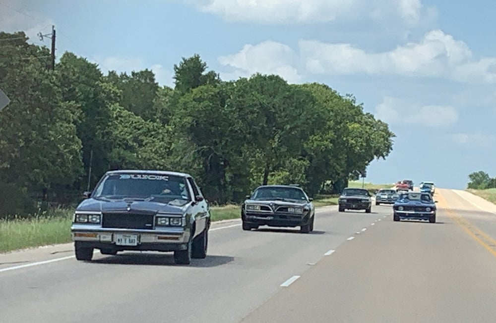 driving shot of Buick T Type in front copy