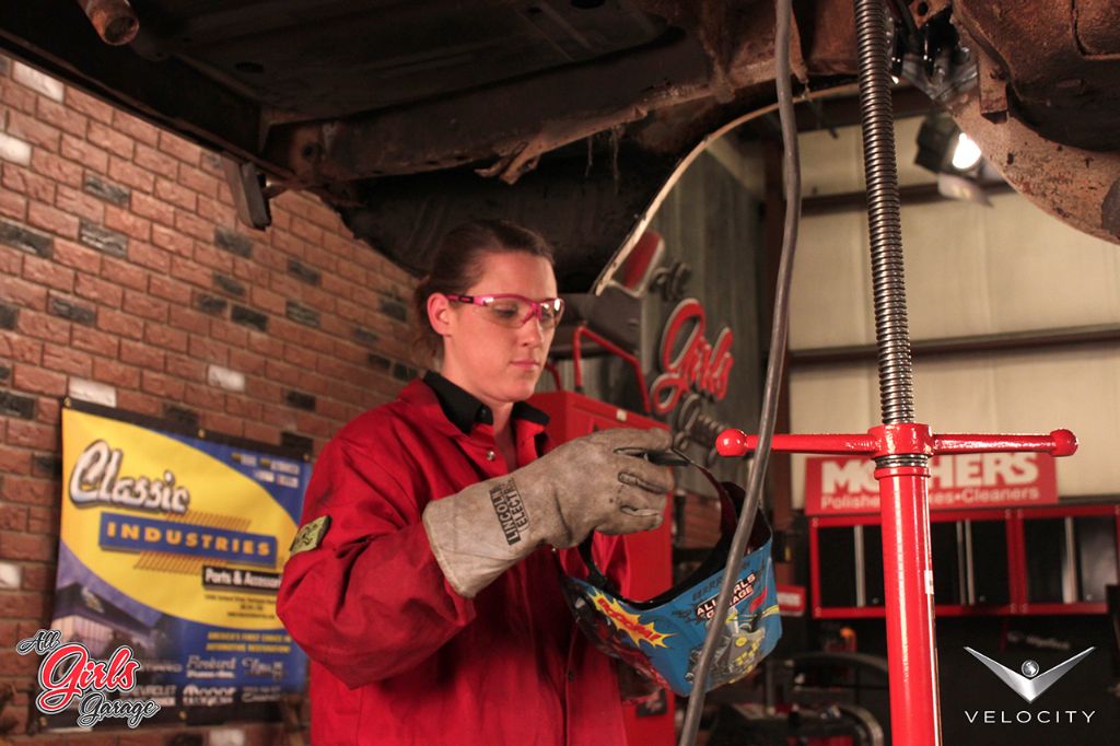 All Girls Garage member Bogi examines the ‘Cuda’s undercarriage. After cleaning out the dirt and rust, the car’s suspension, brakes, fuel tank, and more will be replaced with new parts from Classic Industries.
